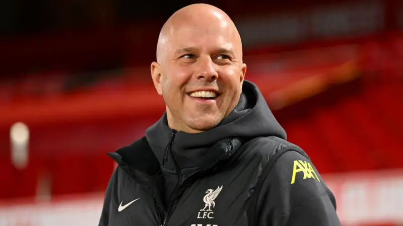 Arne Slot, Liverpool FC's innovative manager, strategizing on the sideline